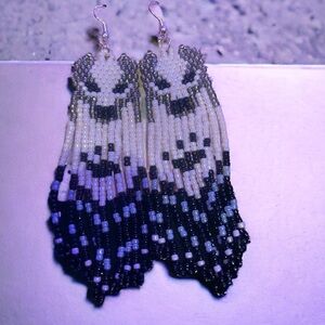 gorgeous beaded wolf fringe earrings